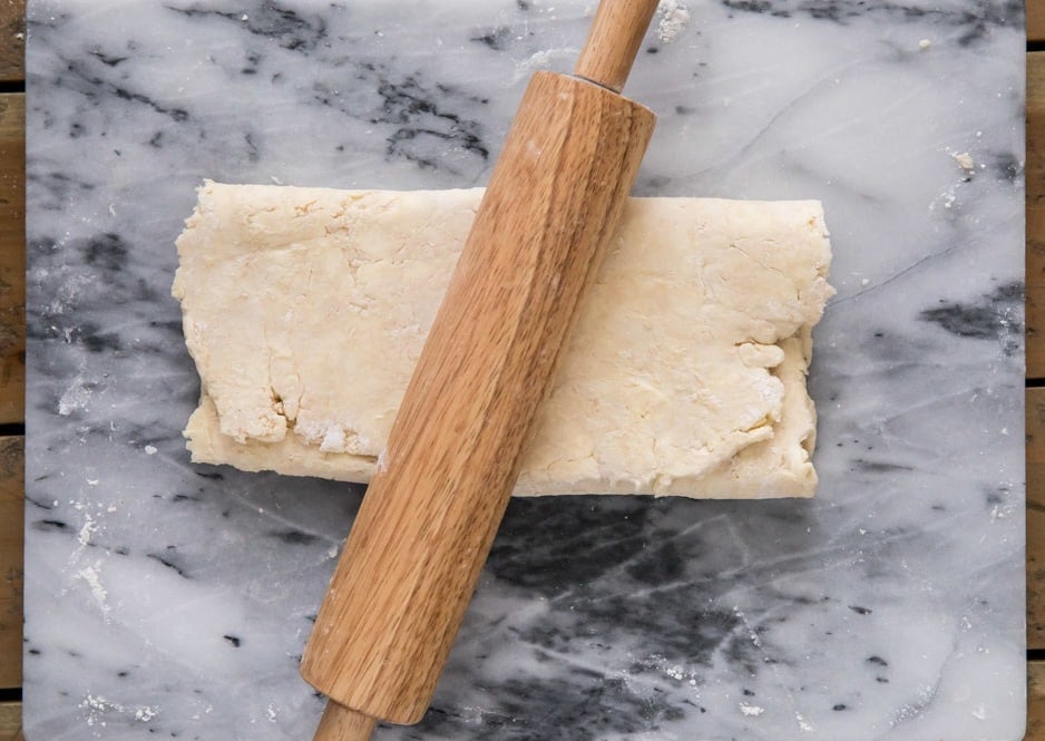 making puff pastry: rotate dough and roll out again