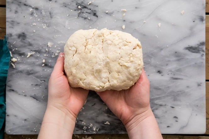 Forming puff pastry dough into a "brick"