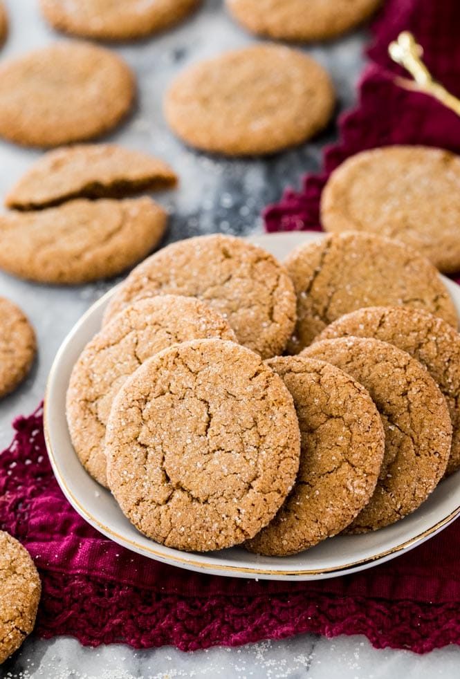 Gingersnap cookies on a white plate on a red napkin