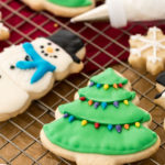cookies decorated with royal icing on cooling rack