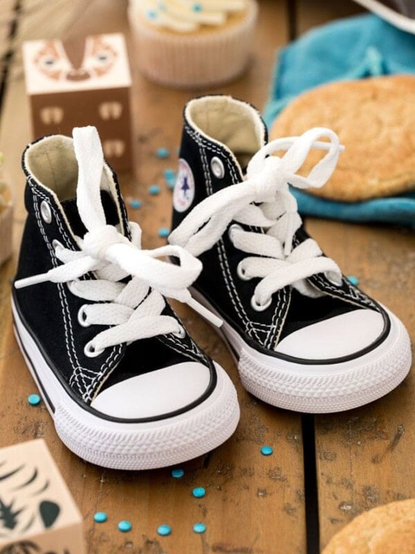 baby shoes on wood surface