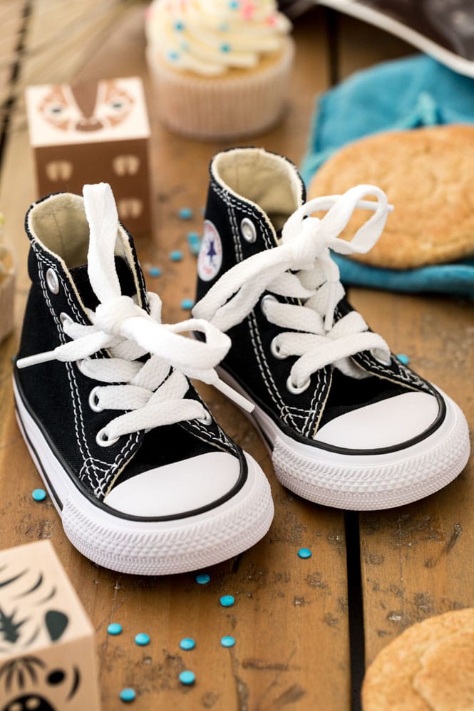 baby shoes on wood surface