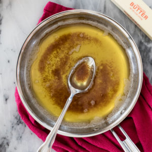 brown butter in sauce pan with a spoon