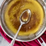 brown butter in sauce pan on marble surface