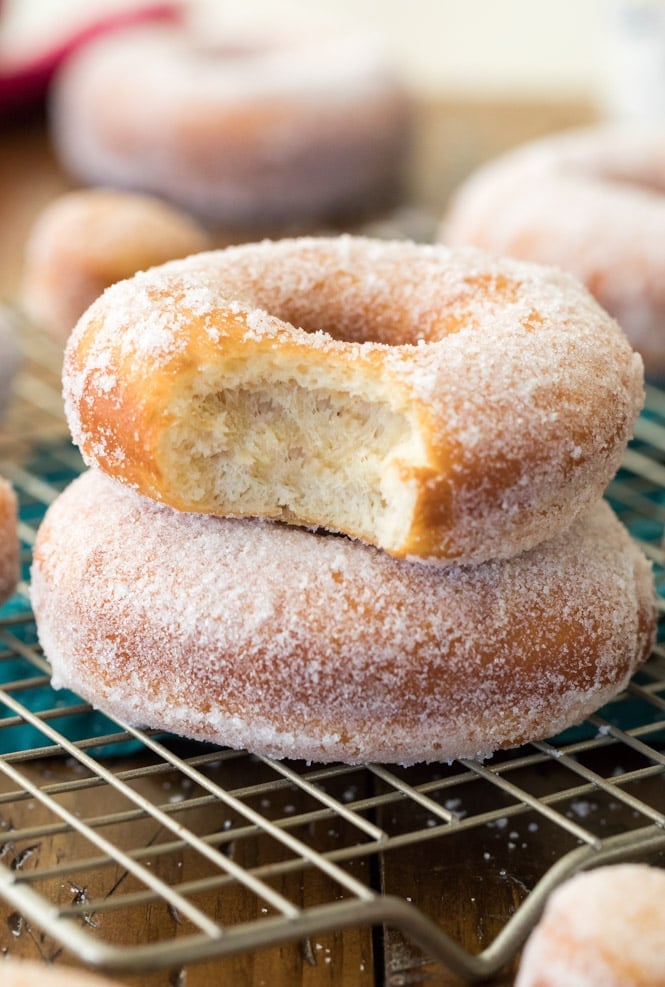 Homemade donut with a bite out of it, showing the soft fluffy interior 