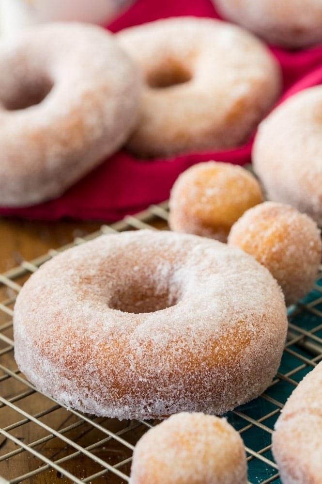 Homemade donuts that have been coated with granulated sugar