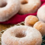 sugared donuts on cooling rack