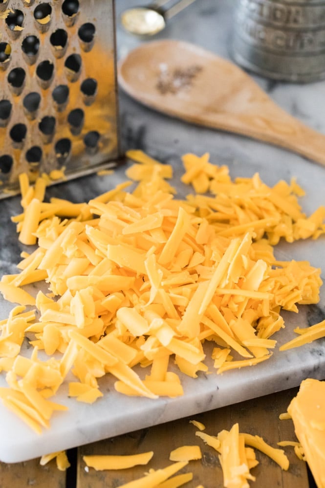 Freshly grated cheddar cheese: key ingredient for cheddar drop biscuits