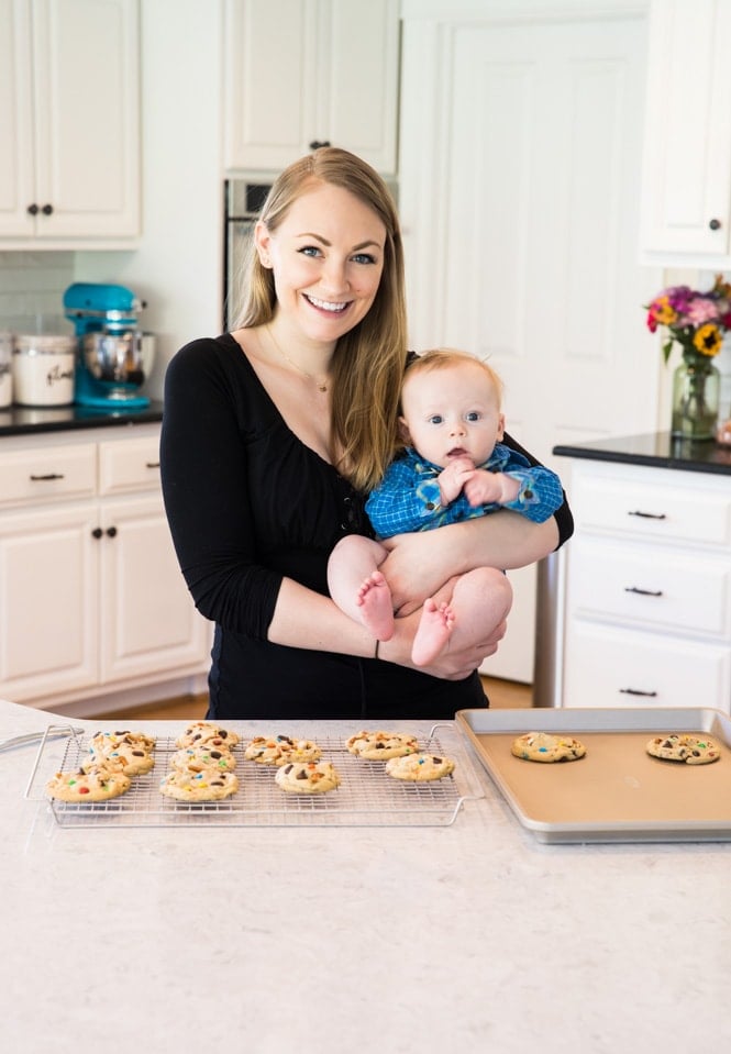 Samantha holding baby luke in kitchen