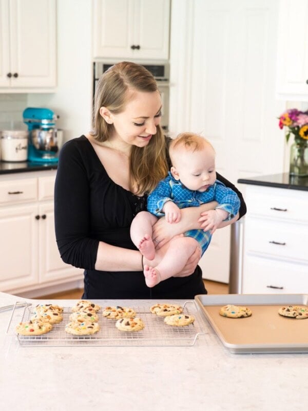 Samantha holding baby Luke in kitchen