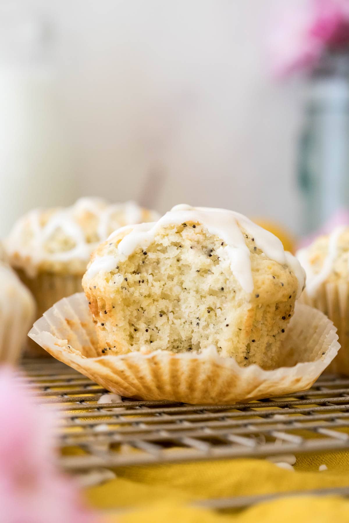 Muffin with bite out of it on gold cooling rack