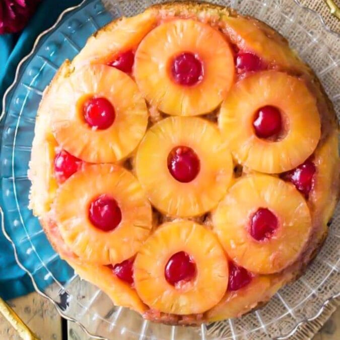 overhead of pineapple upside down cake on crystal platter