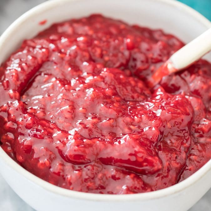 raspberry cake filling in white bowl