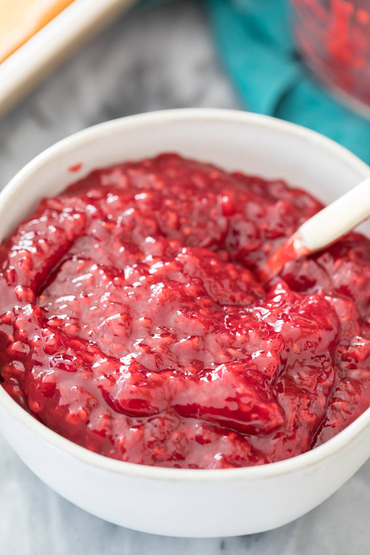 raspberry cake filling in white bowl