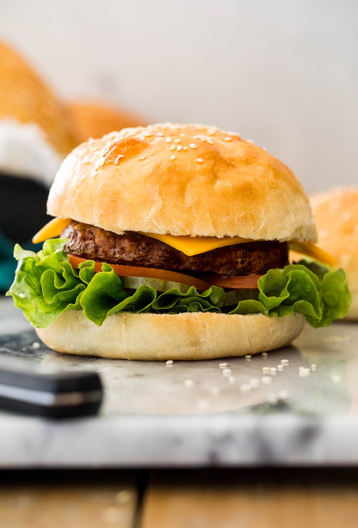 burger on white marble board