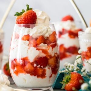 glasses of eton mess (layers of whipped cream/meringue and strawberries)