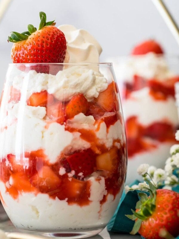 glasses of eton mess (layers of whipped cream/meringue and strawberries)
