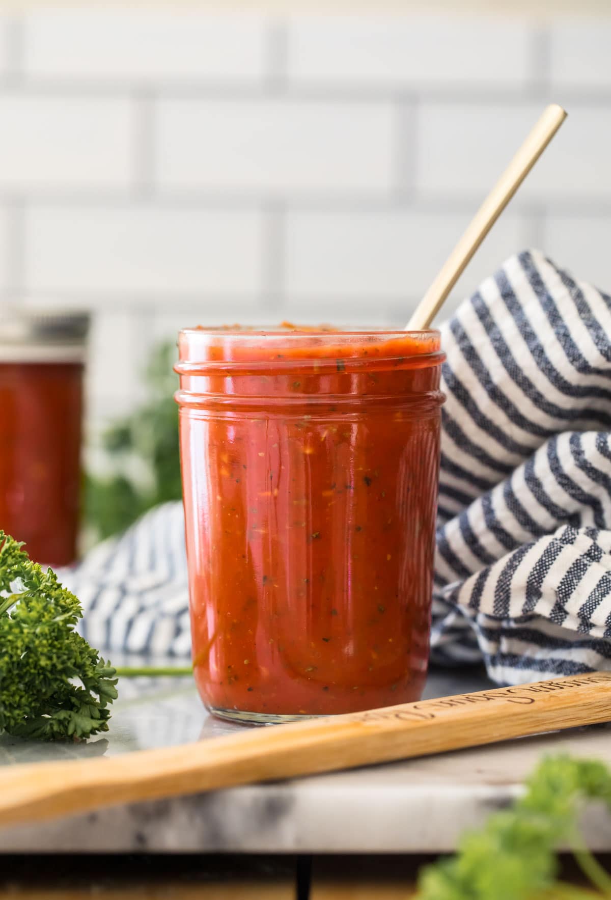 red sauce in glass jar on counter
