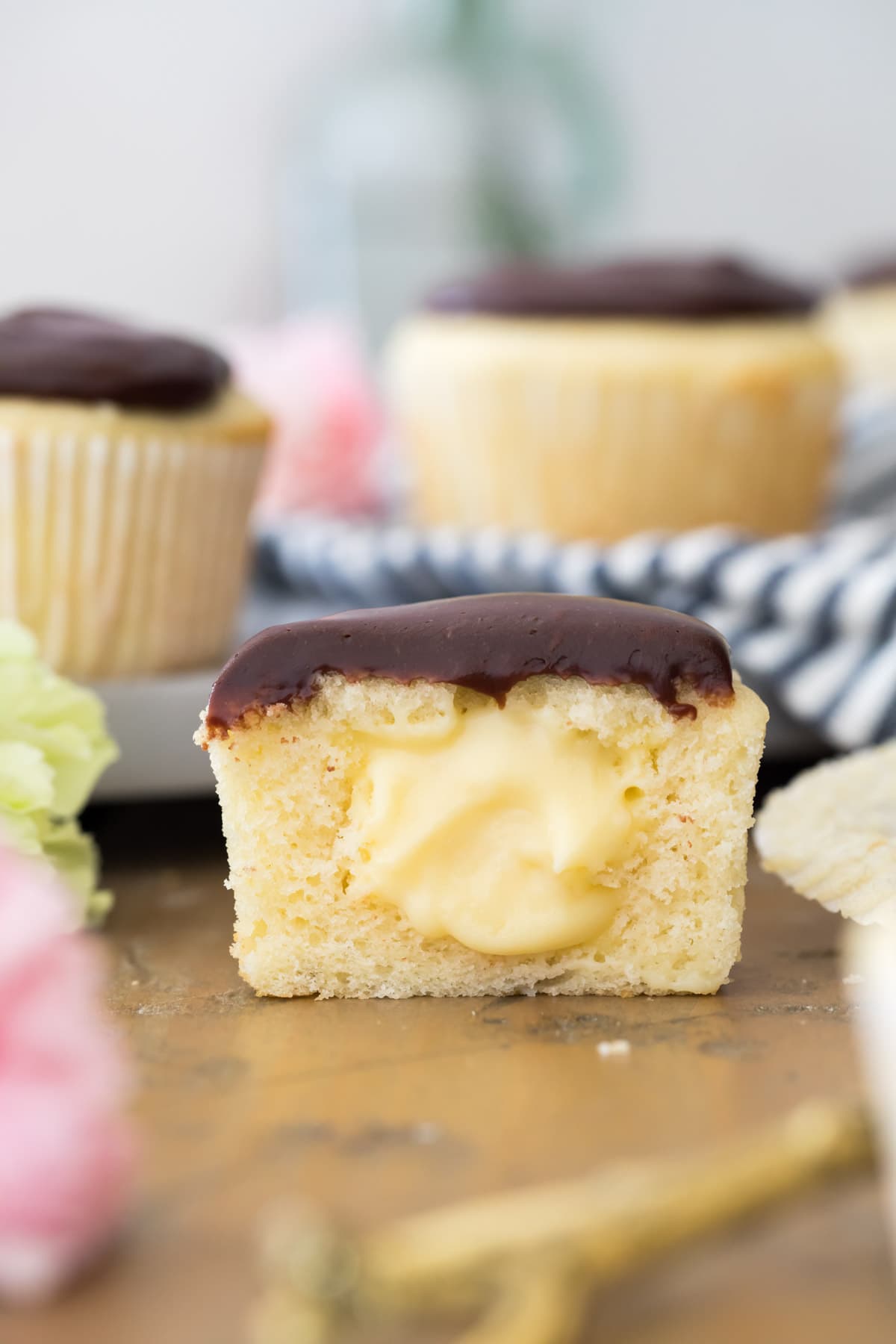 boston cream cupcake cut in half to show center