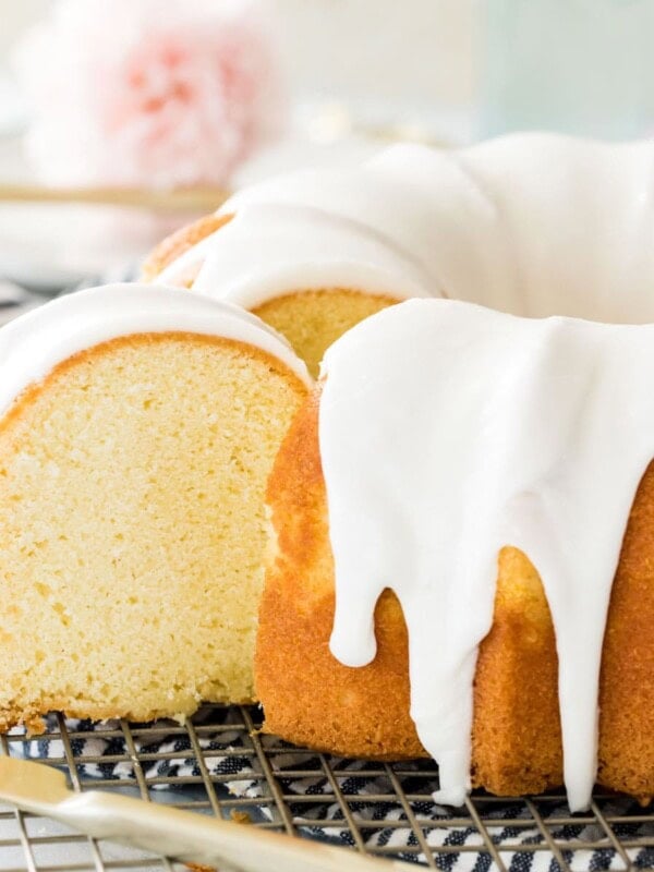 sliced vanilla bundt cake on cooling rack