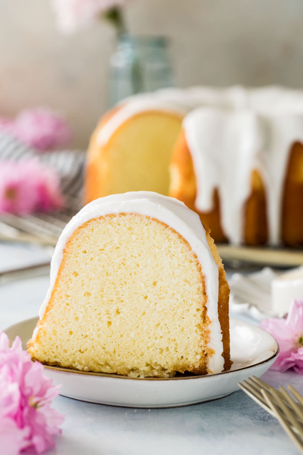 slice of glazed bundt cake on white plate