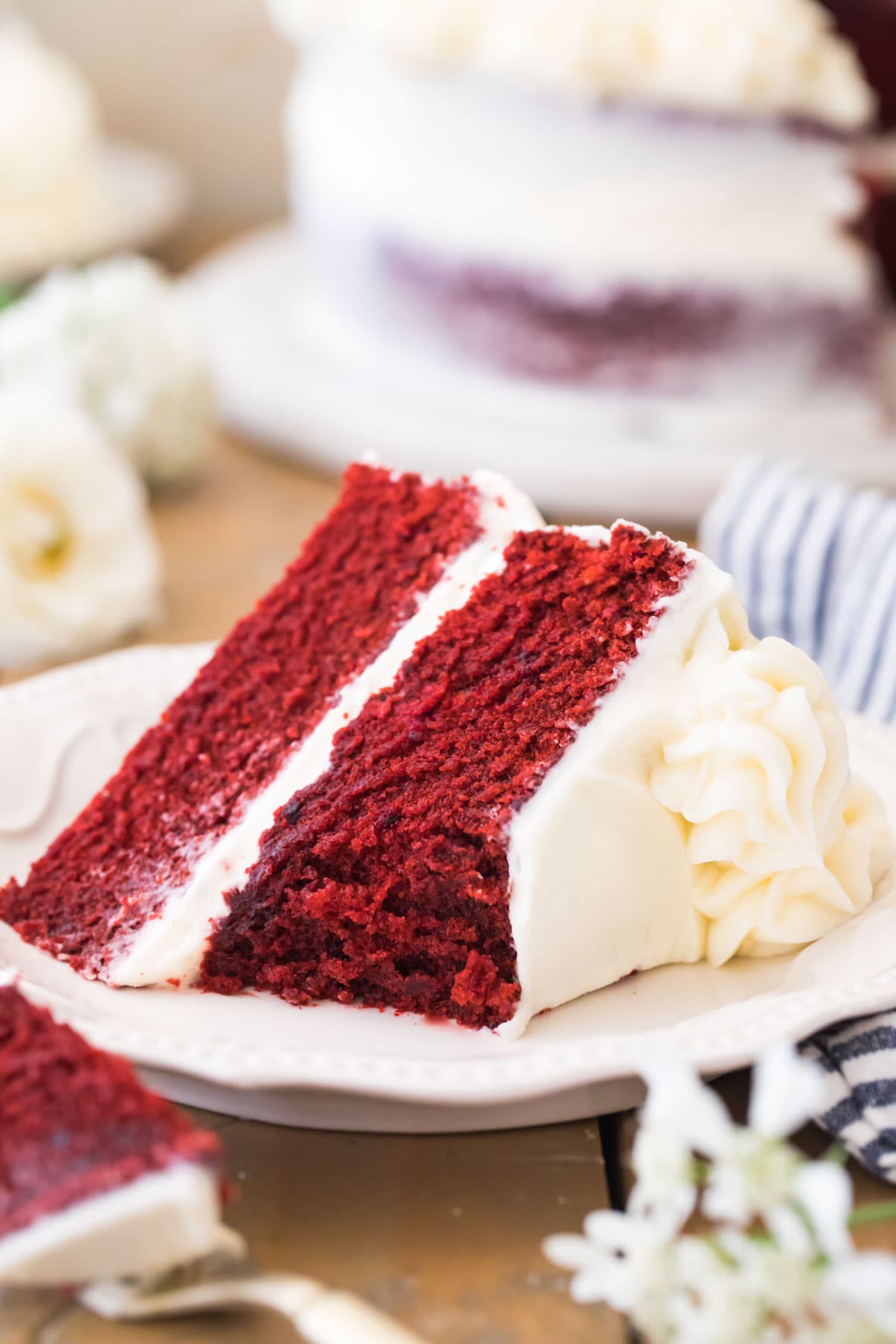 slice of red cake with bite missing