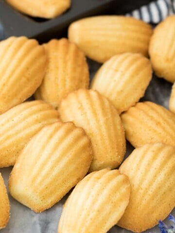Madeleines arranged on marble board
