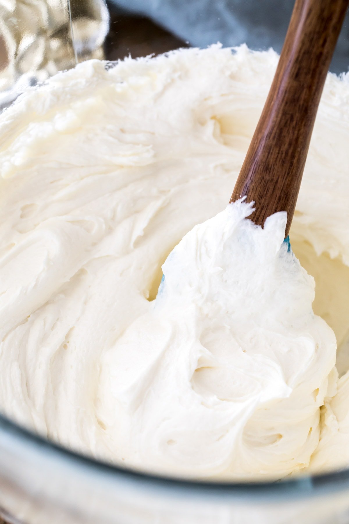 fluffy white icing in mixer bowl