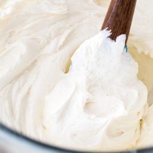 white chocolate buttercream in glass bowl with spatula