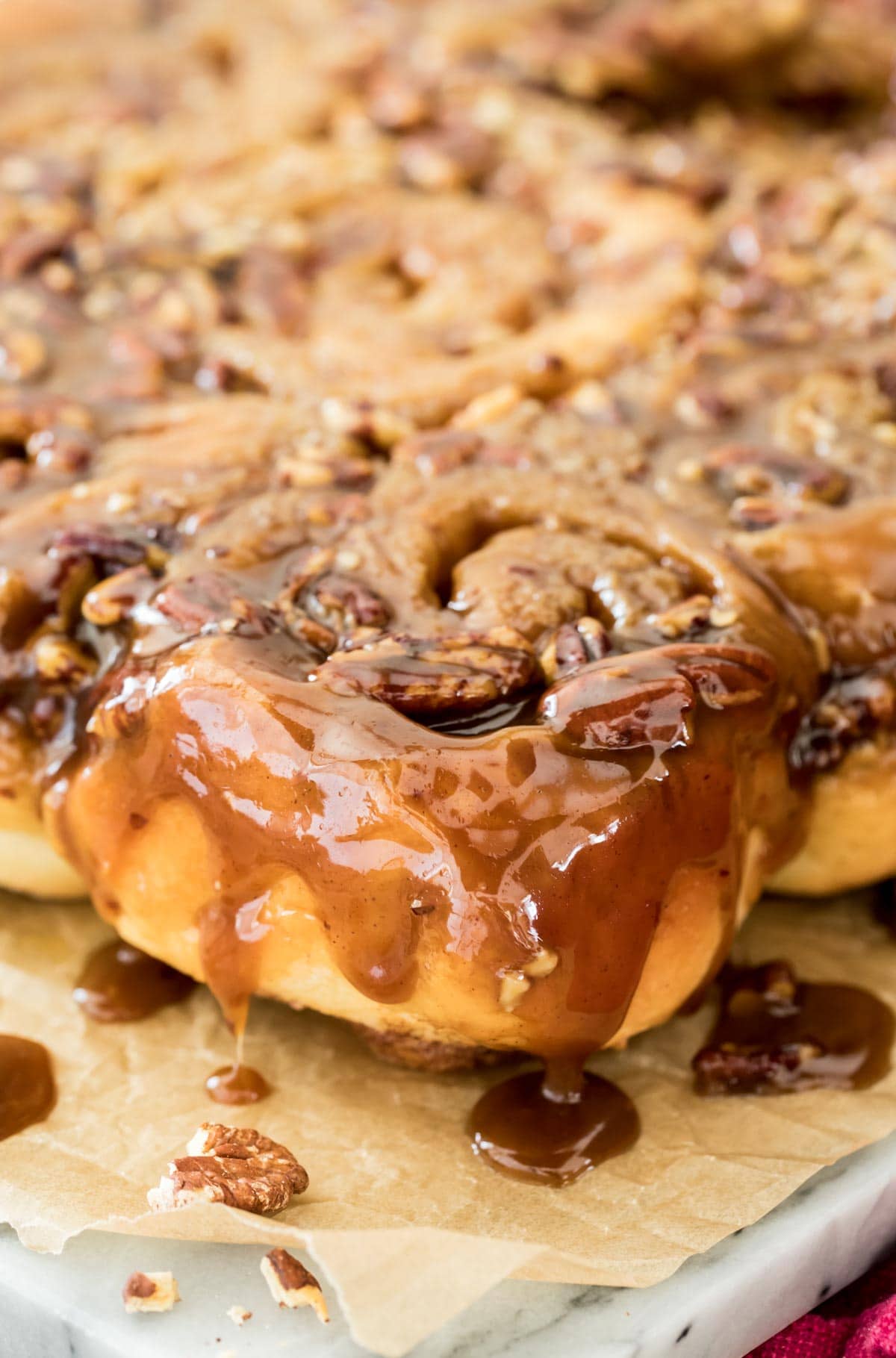 sticky bun with glaze on marble