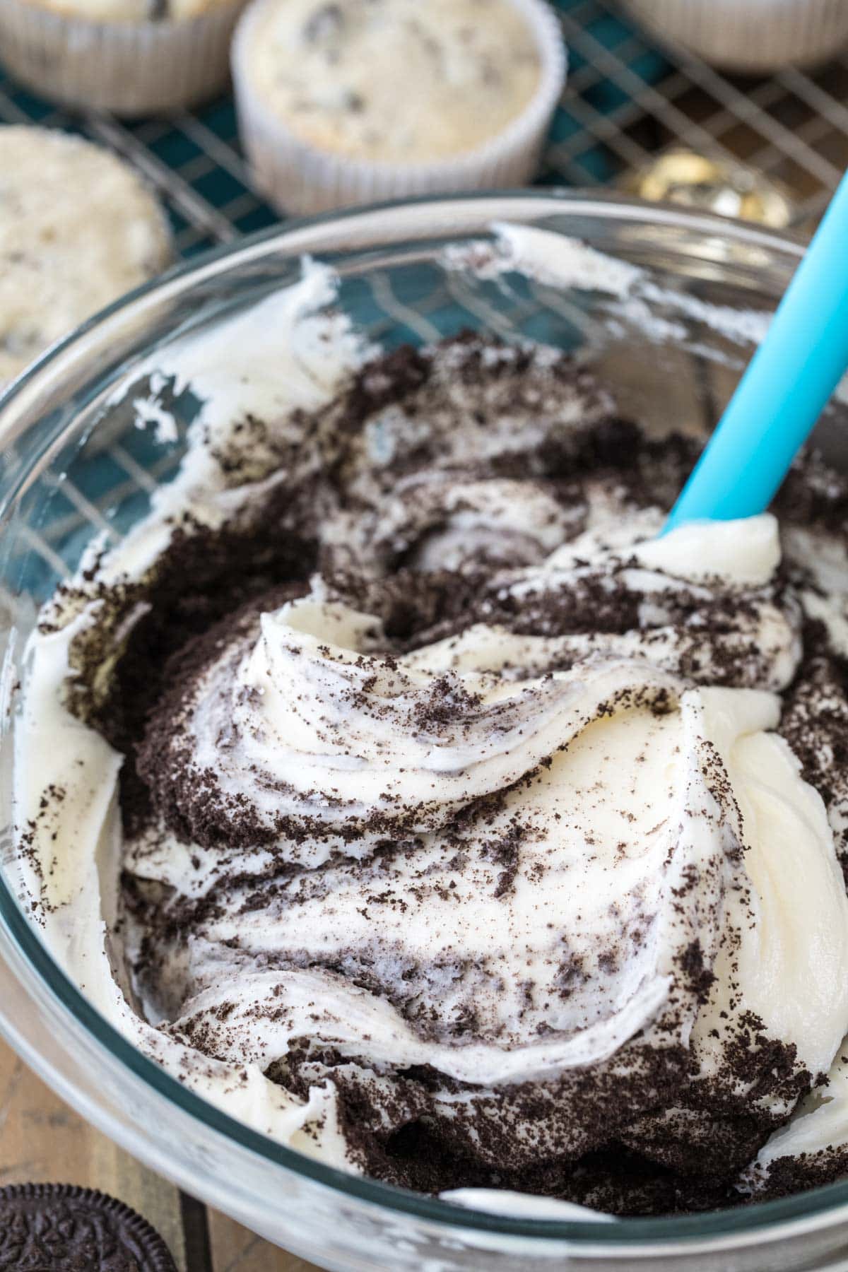 mixing cookie crumbs into cream cheese frosting