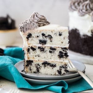 slice of three layer oreo cake on white plate