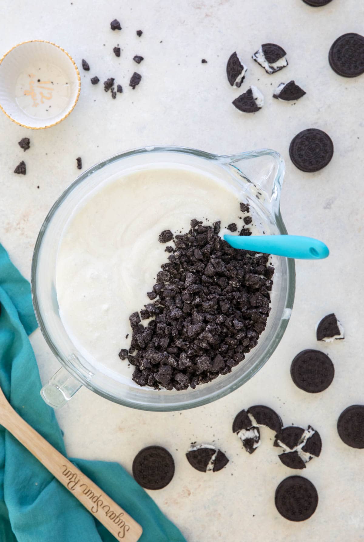 overhead of white cake batter with crushed oreos