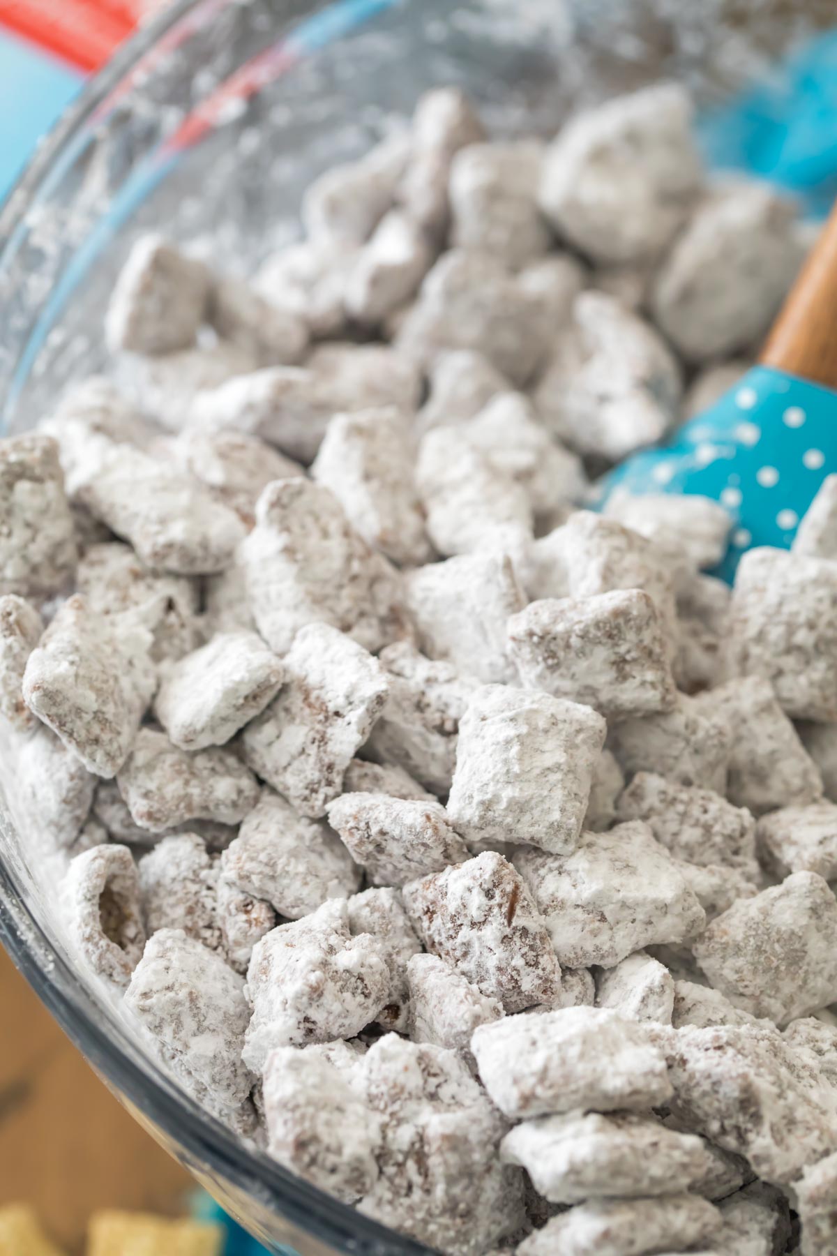 stirring powdered sugar over chocolate coated cereal