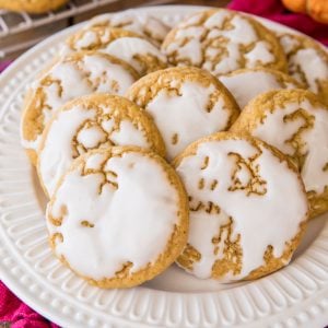 glazed pumpkin cookies on white plate