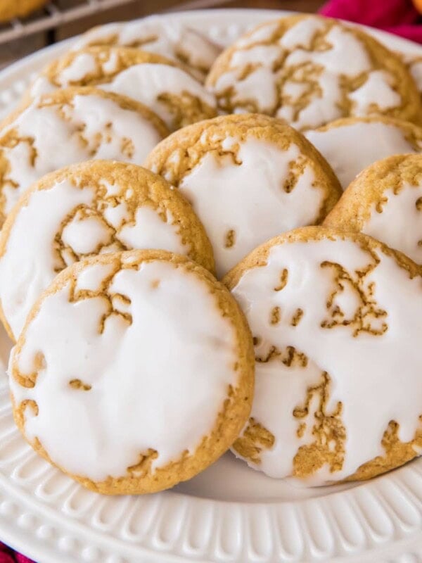 glazed pumpkin cookies on white plate