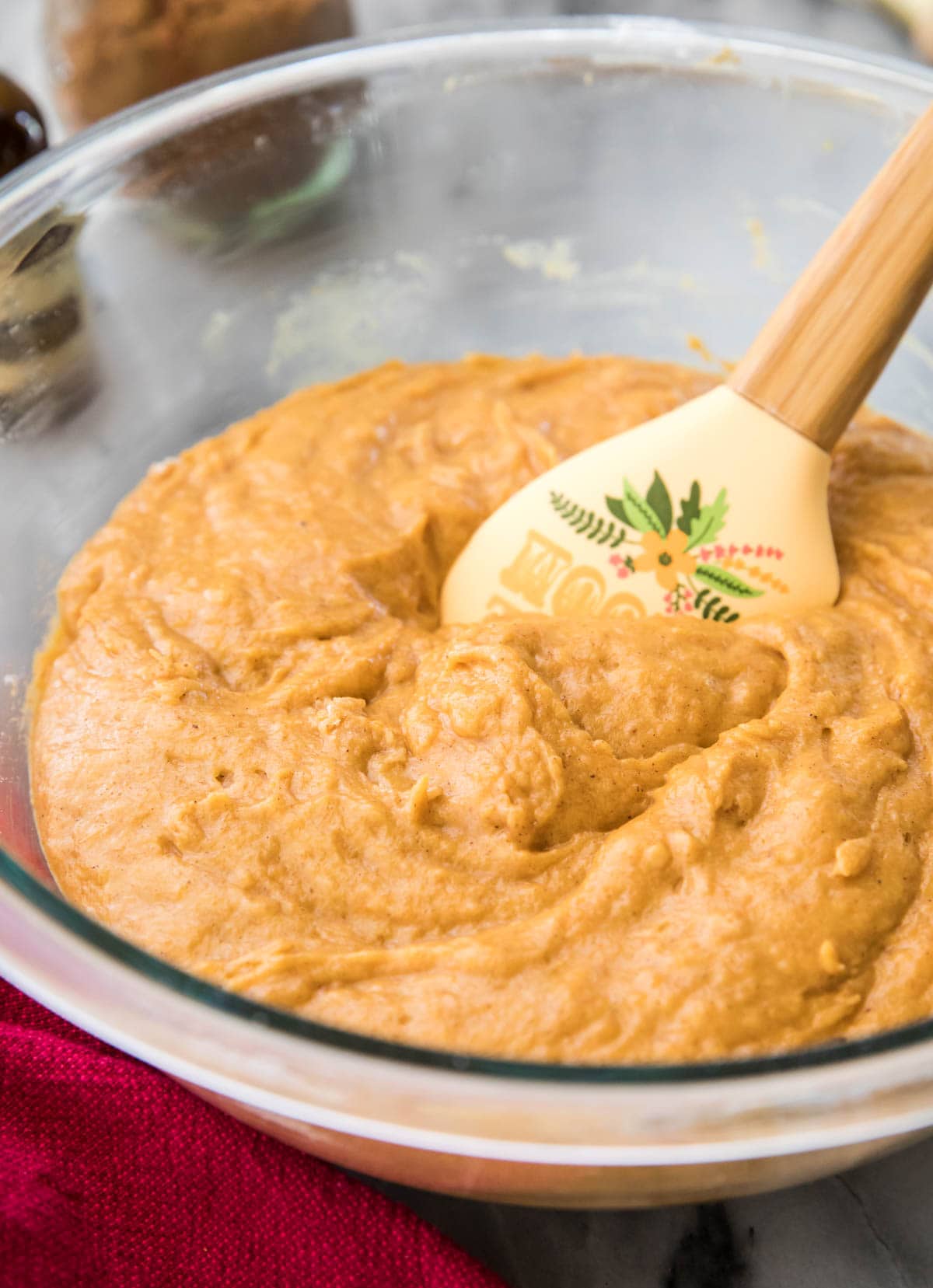 orange batter in glass bowl