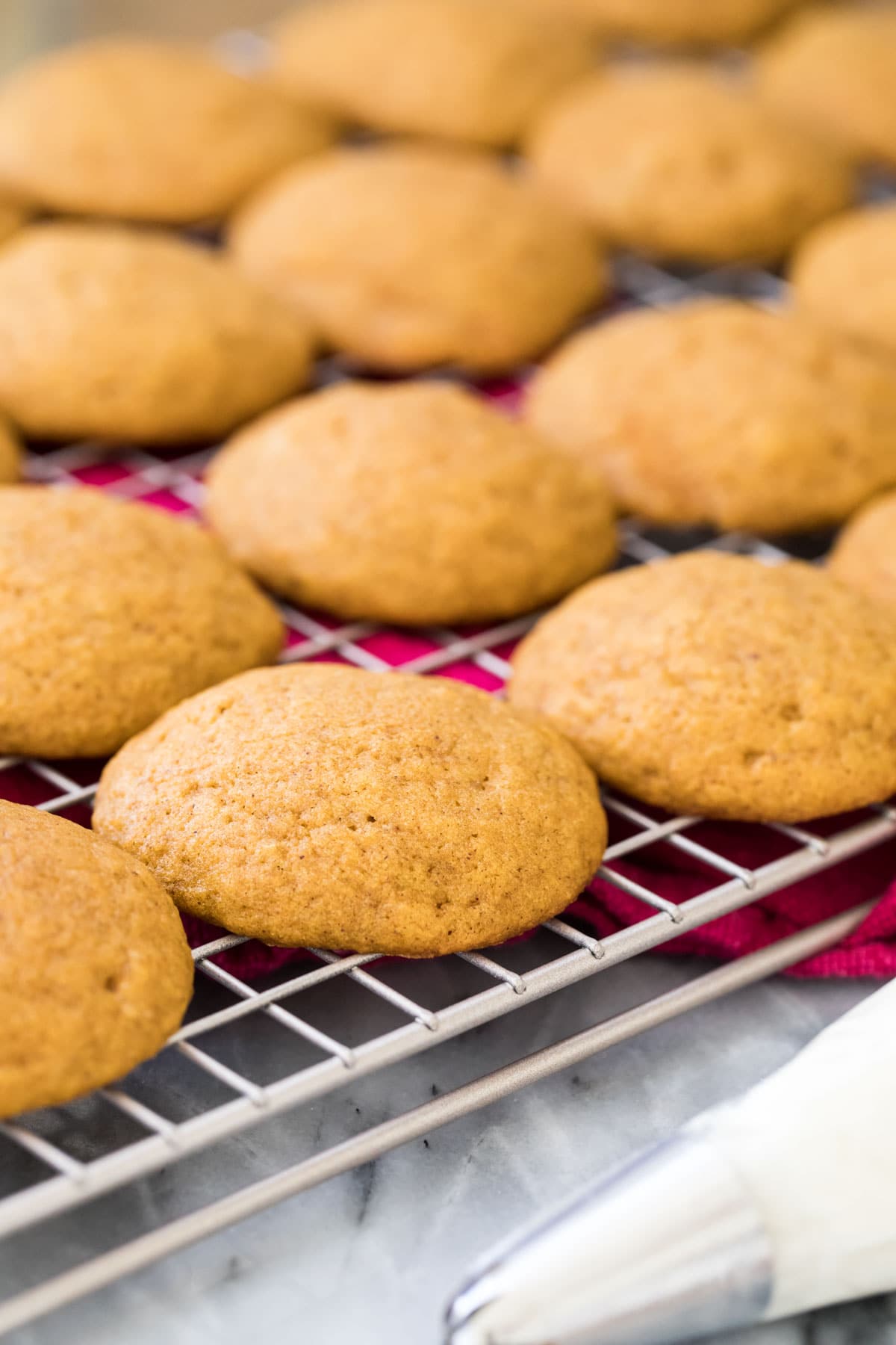 cakey pumpkin cookies on cooling rack