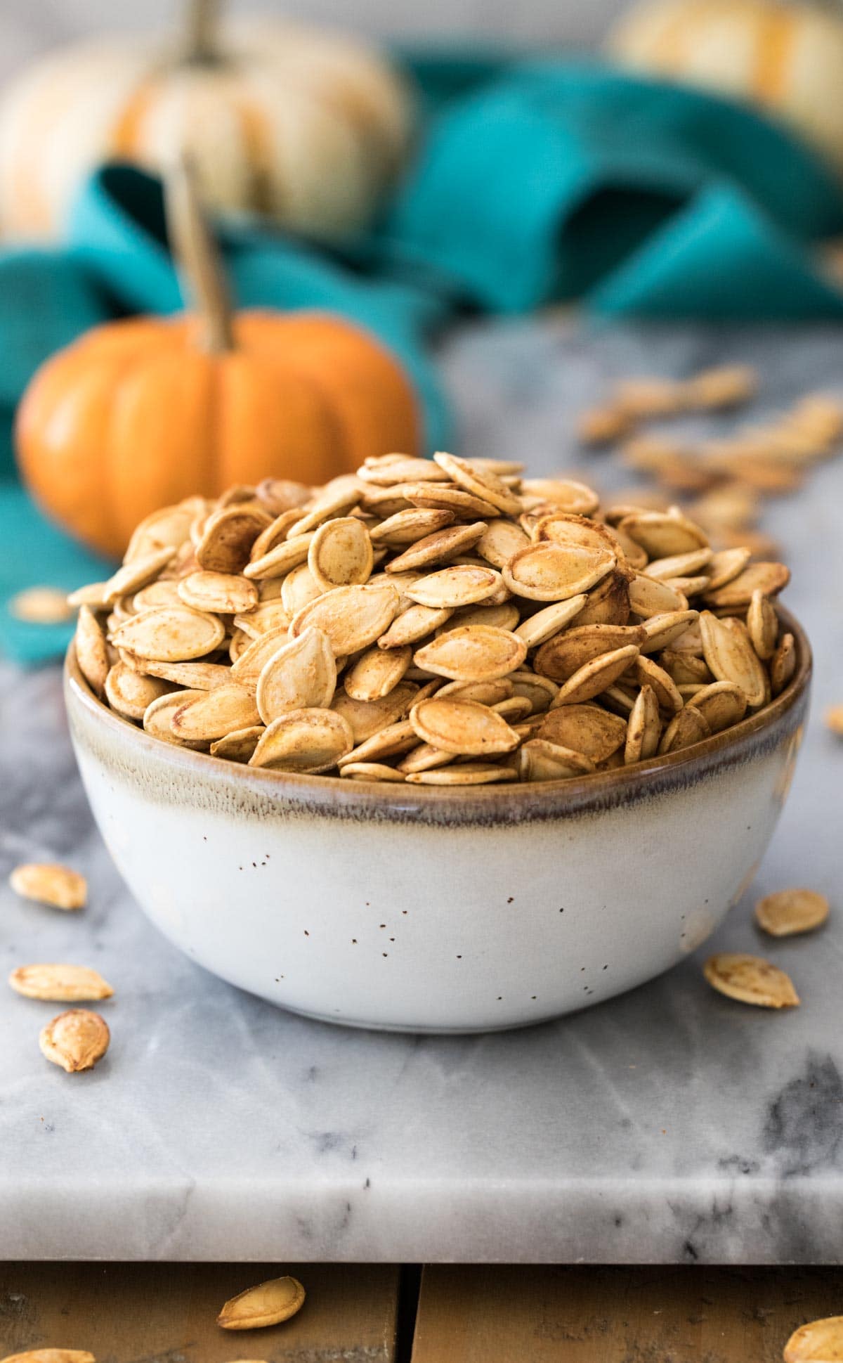 pumpkin seeds in small gray bowl