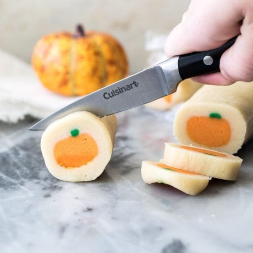 slicing pumpkin sugar cookie dough