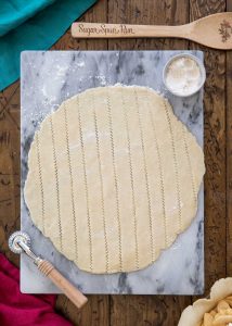 cutting pie dough into strips