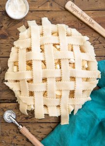 woven pie crust strips over apple pie