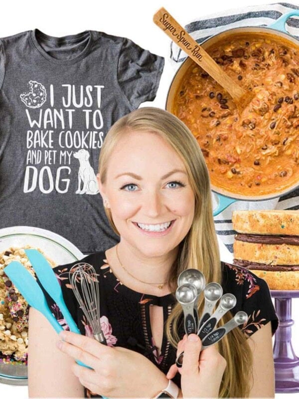 the author holding kitchen utensils with products in background