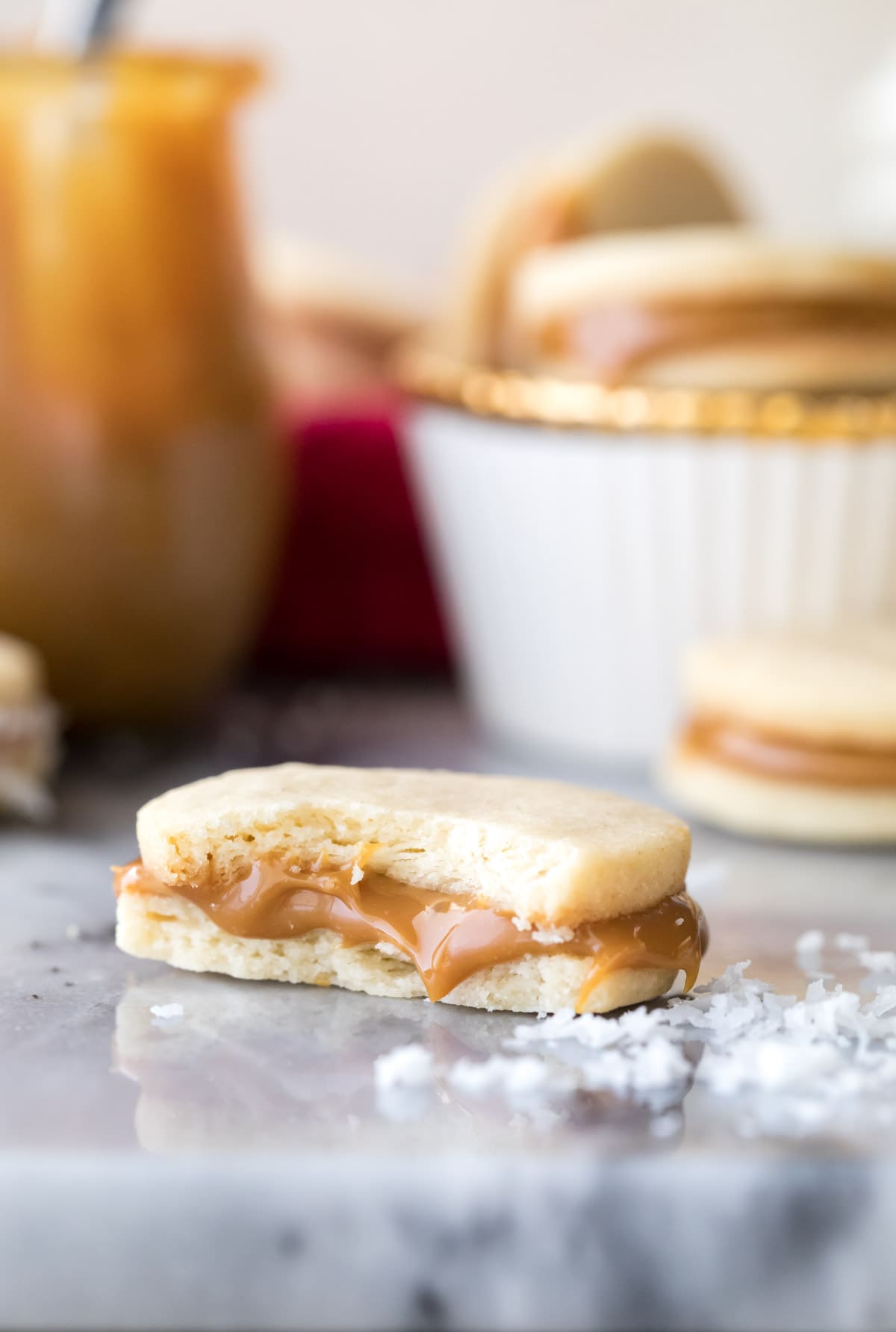 dulce de leche sandwich cookie bitten in half