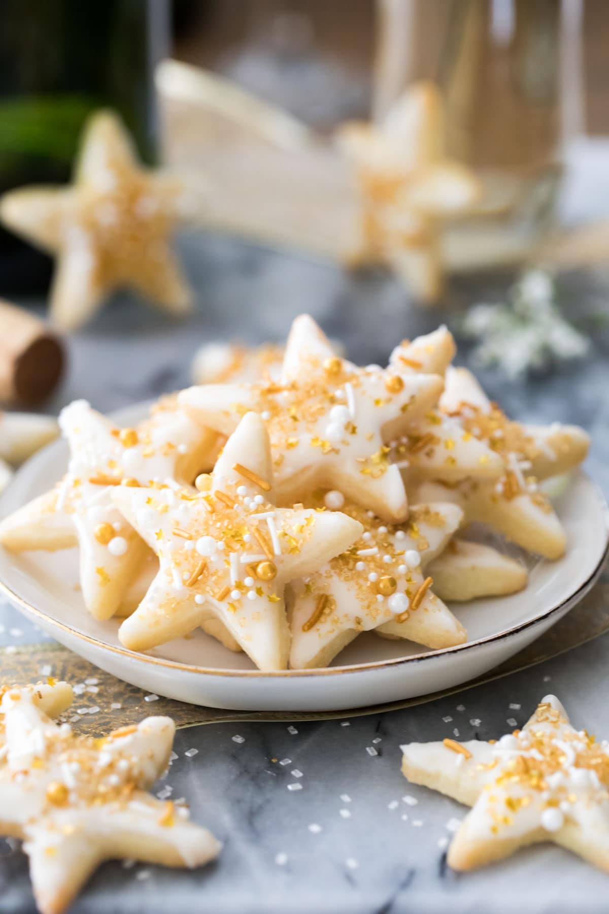 champagne star cookies on a white plate