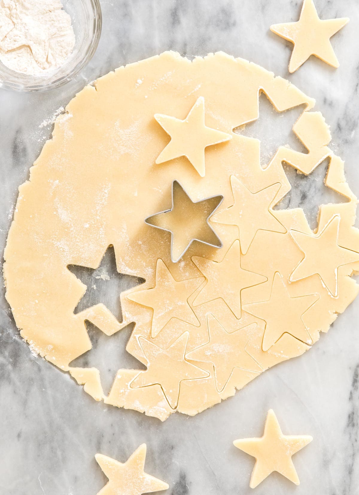 cutting star shapes out of cookie dough