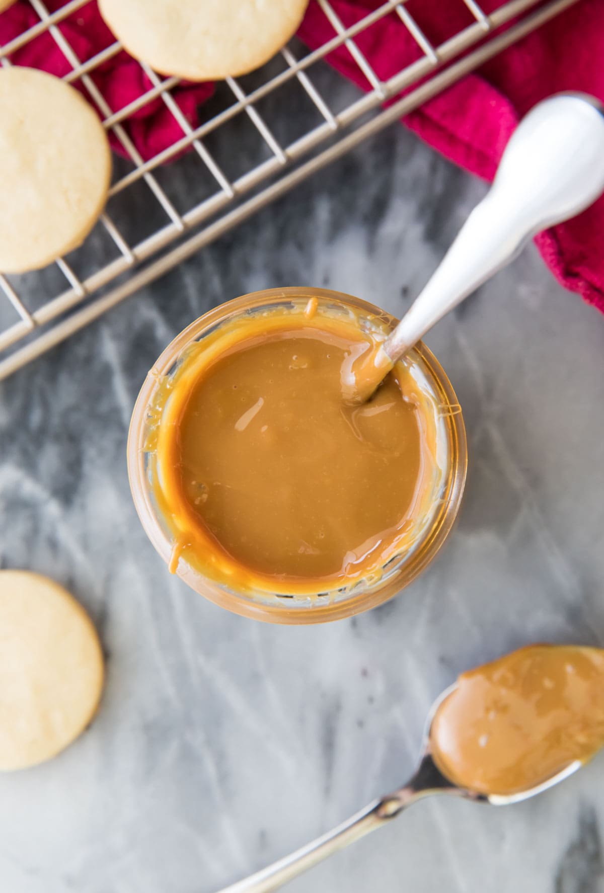 overhead of dulce de leche in glass jar