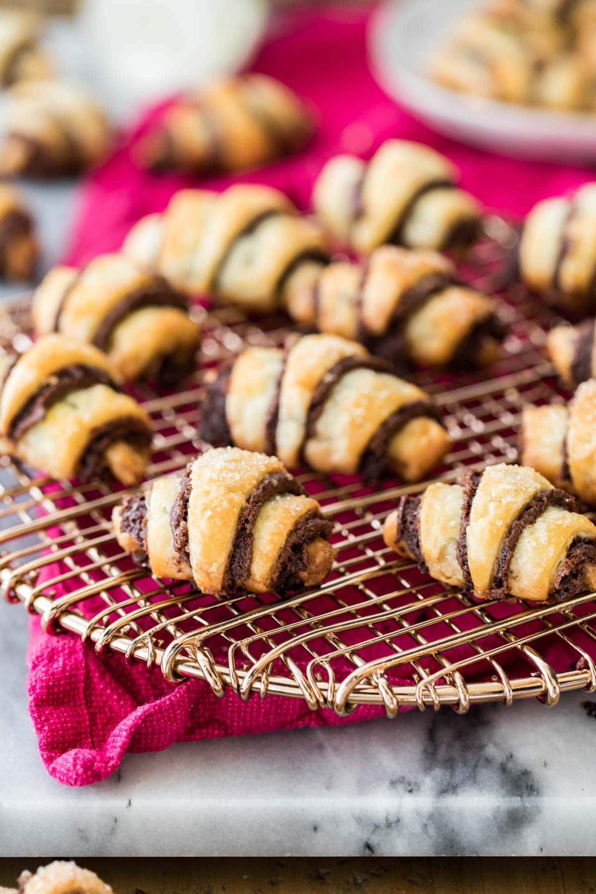 chocolate rugelach arranged on cooling rack