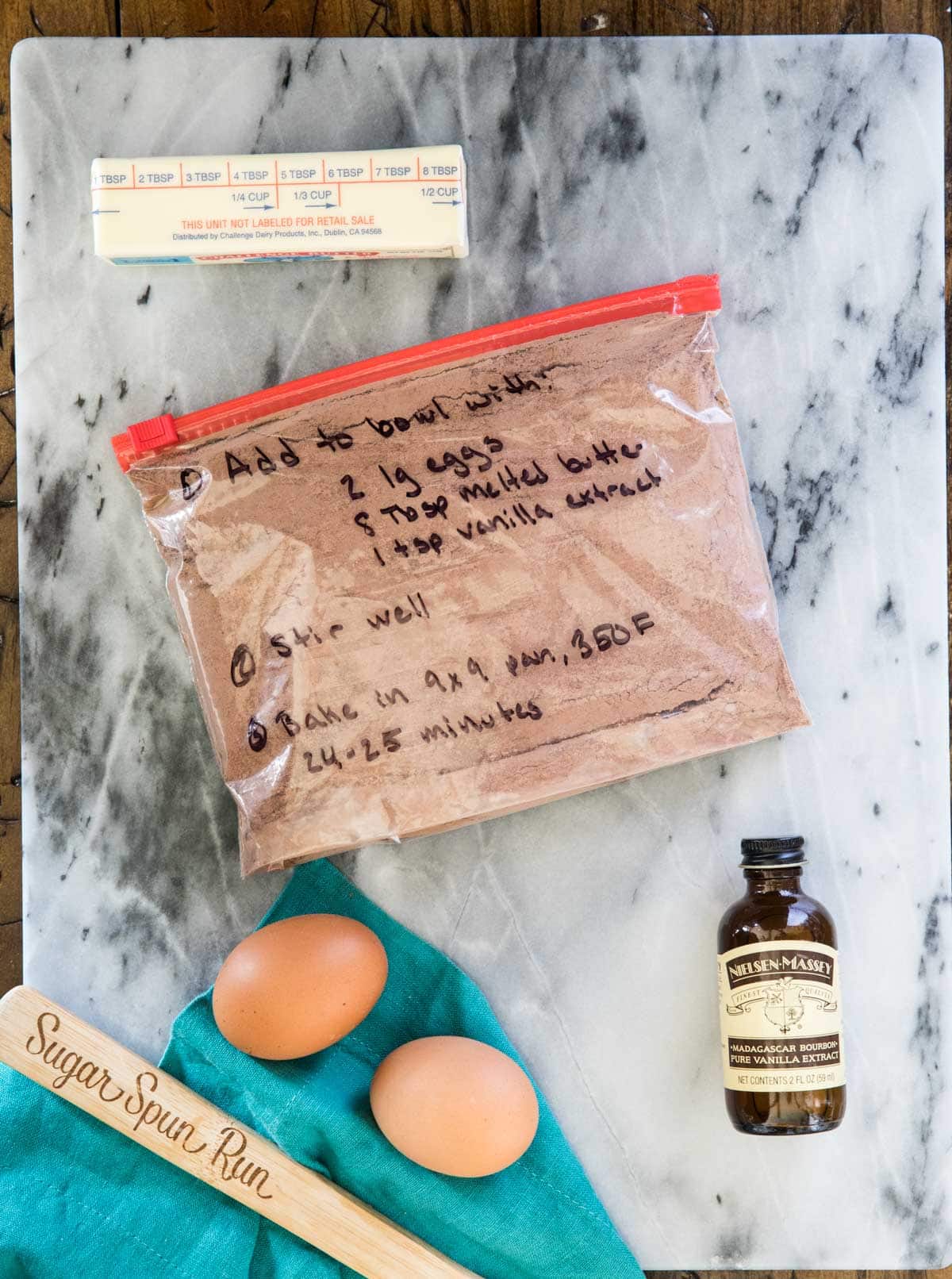 brownie mix in ziploc bag surrounded by ingredients