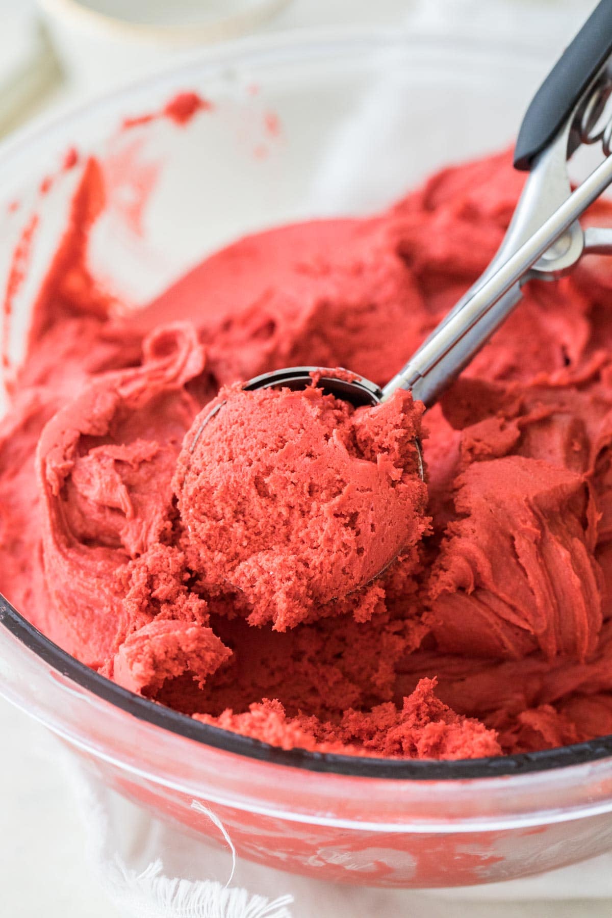 red velvet cookie dough in glass bowl